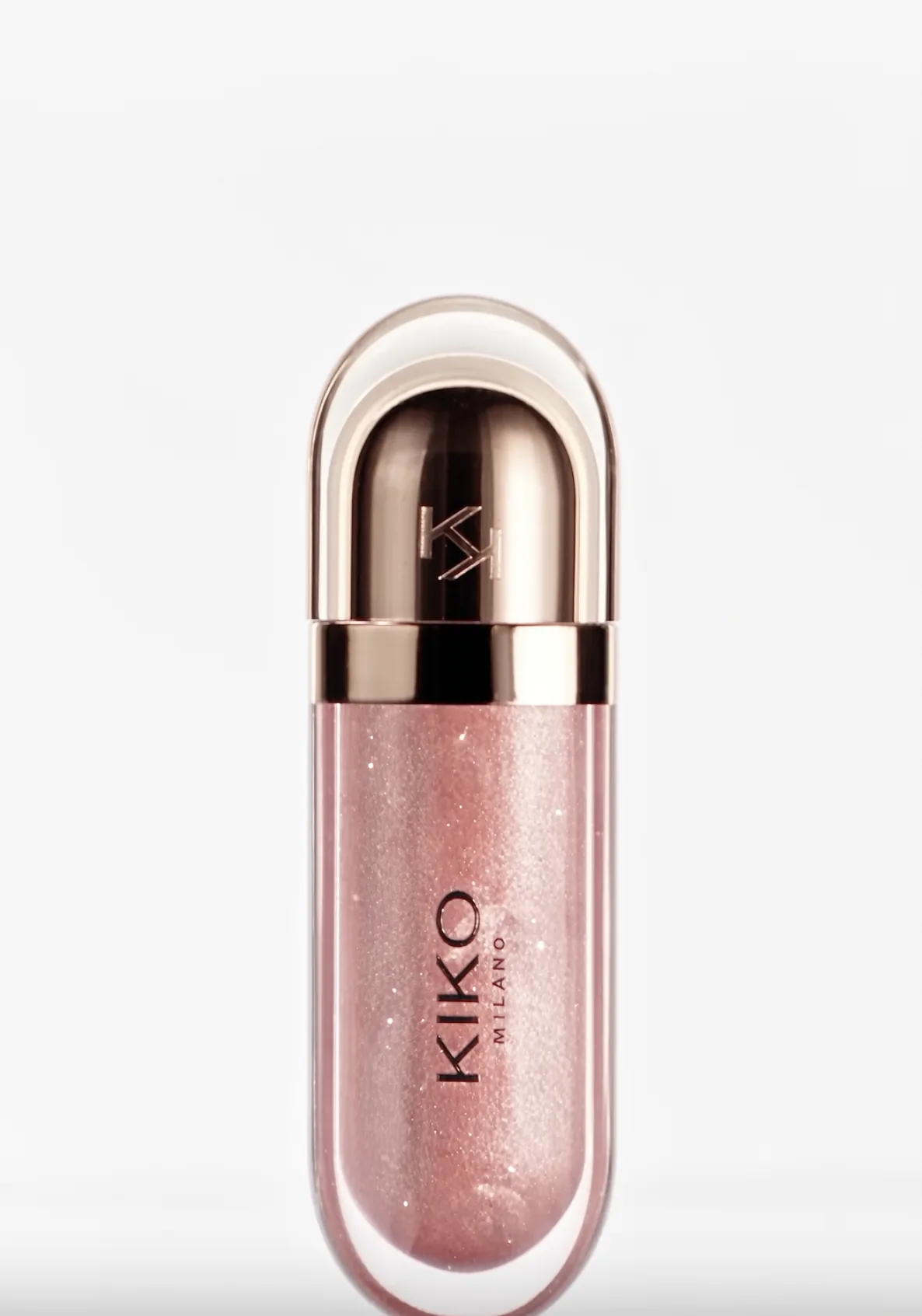 Shimmering pink lip gloss bottle on white